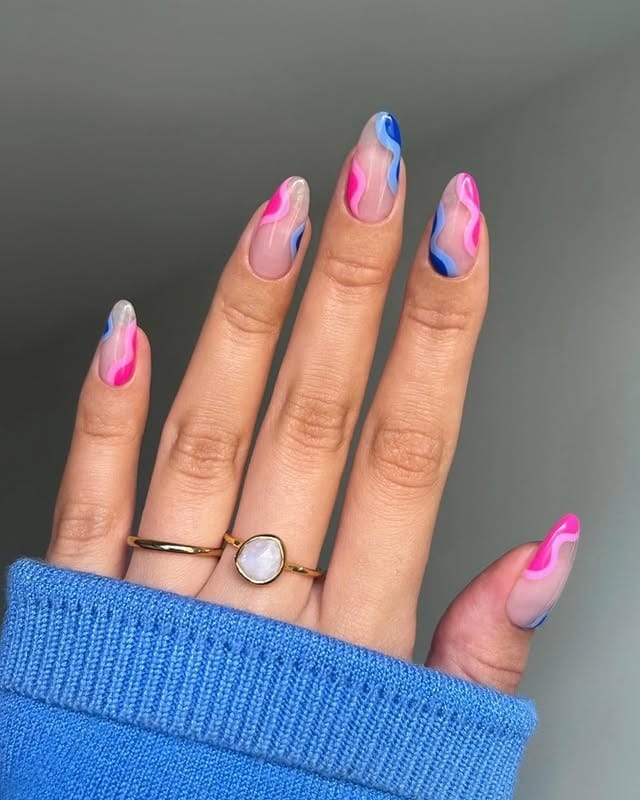 16. Pink and Blue Wavy Almond Nails - pink and blue nail ideas