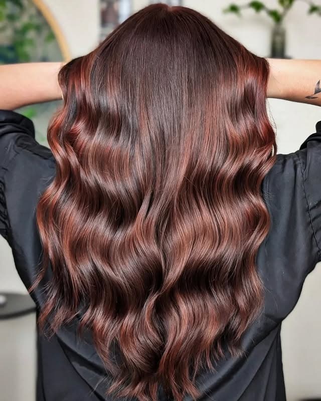 2. Deep Auburn Chocolate Glossy Waves - Winter Hairstyles