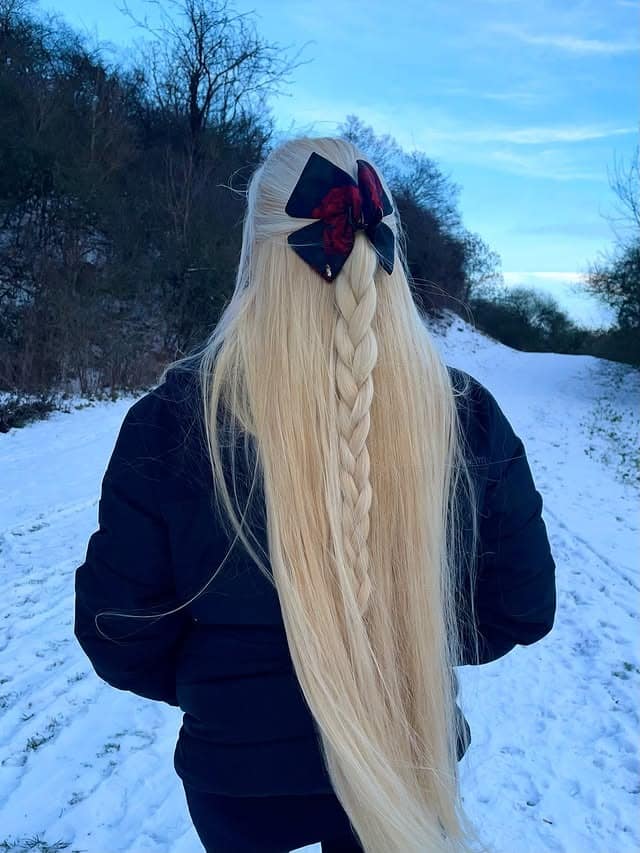 7. Icy Platinum Blonde Half-Up Braid - Winter Hairstyles