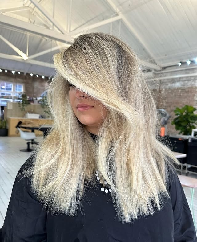 12. Icy Platinum Blonde Layered Lob - Winter Hairstyles