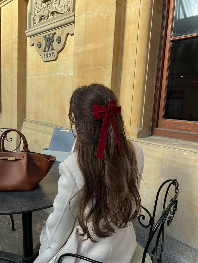 20. Deep Brunette Half-Up Velvet Bow Waves - Winter Hairstyles