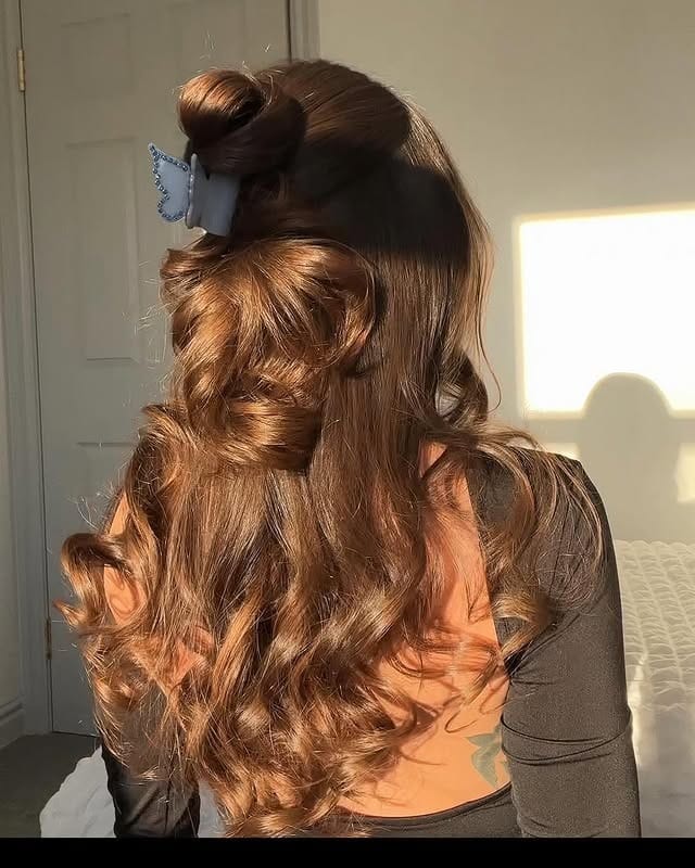 22. Warm Auburn Half-Up Claw Clip Curls - Winter Hairstyles