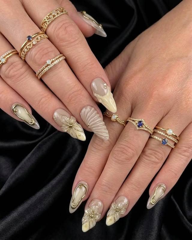 14. Champagne Gold 3D Floral Almond Nails - prom nail ideas