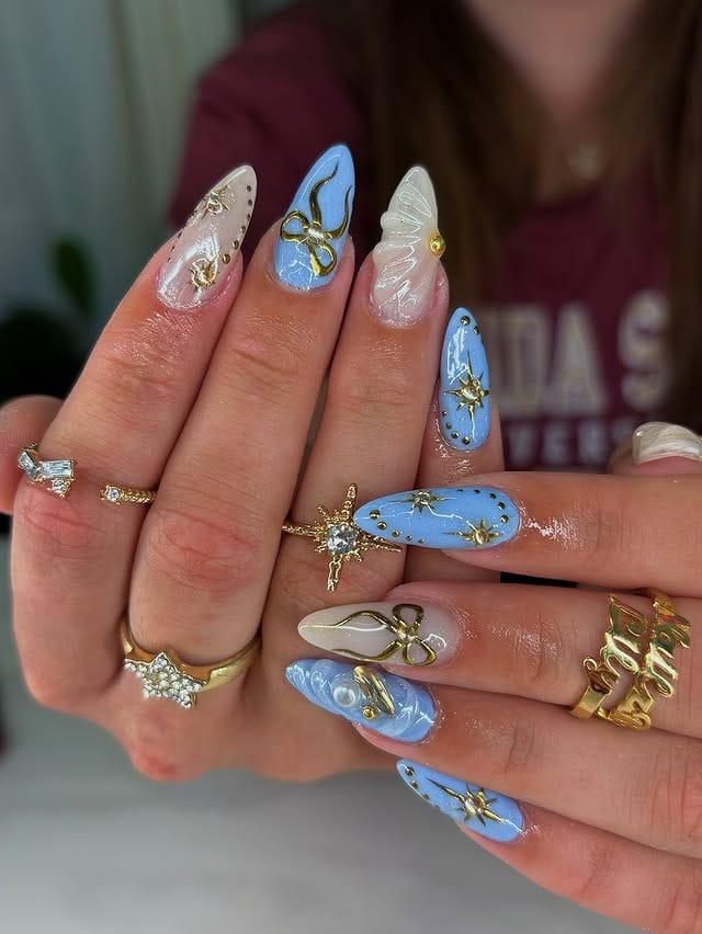 19. Powder Blue and Gold Celestial Almond Nails - prom nail ideas