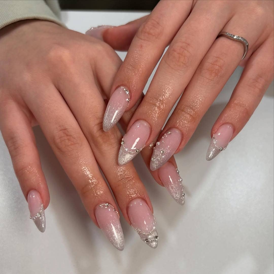21. Silver Glitter French Almond Nails - prom nail ideas