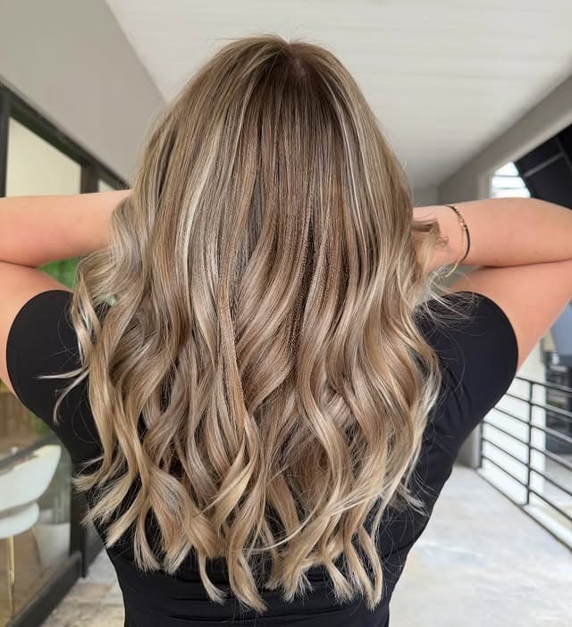 14. Long Dark Blonde Curls with Champagne Highlights - Dark Blonde Hair Color with Highlights