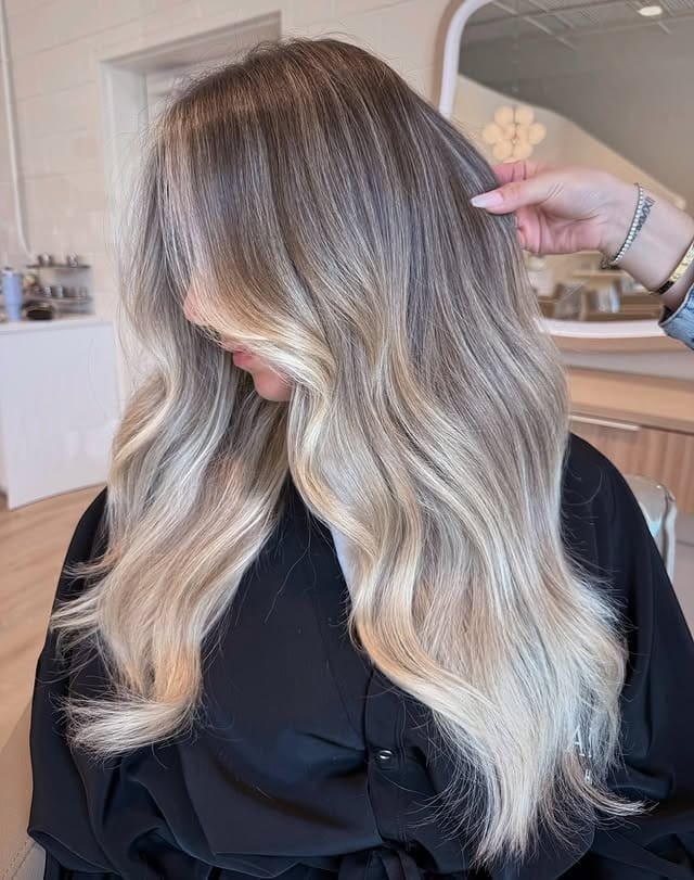 19. Voluminous Dark Blonde Waves with Creamy Highlights - Dark Blonde Hair Color with Highlights