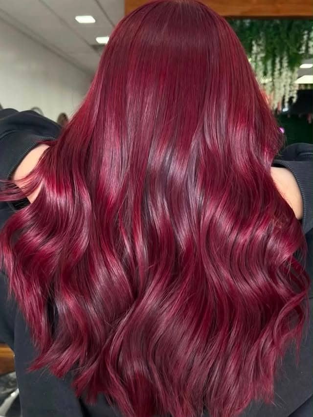 19. Vibrant Cherry Cola Hair with Glossy Waves - Cherry Cola Hair Color
