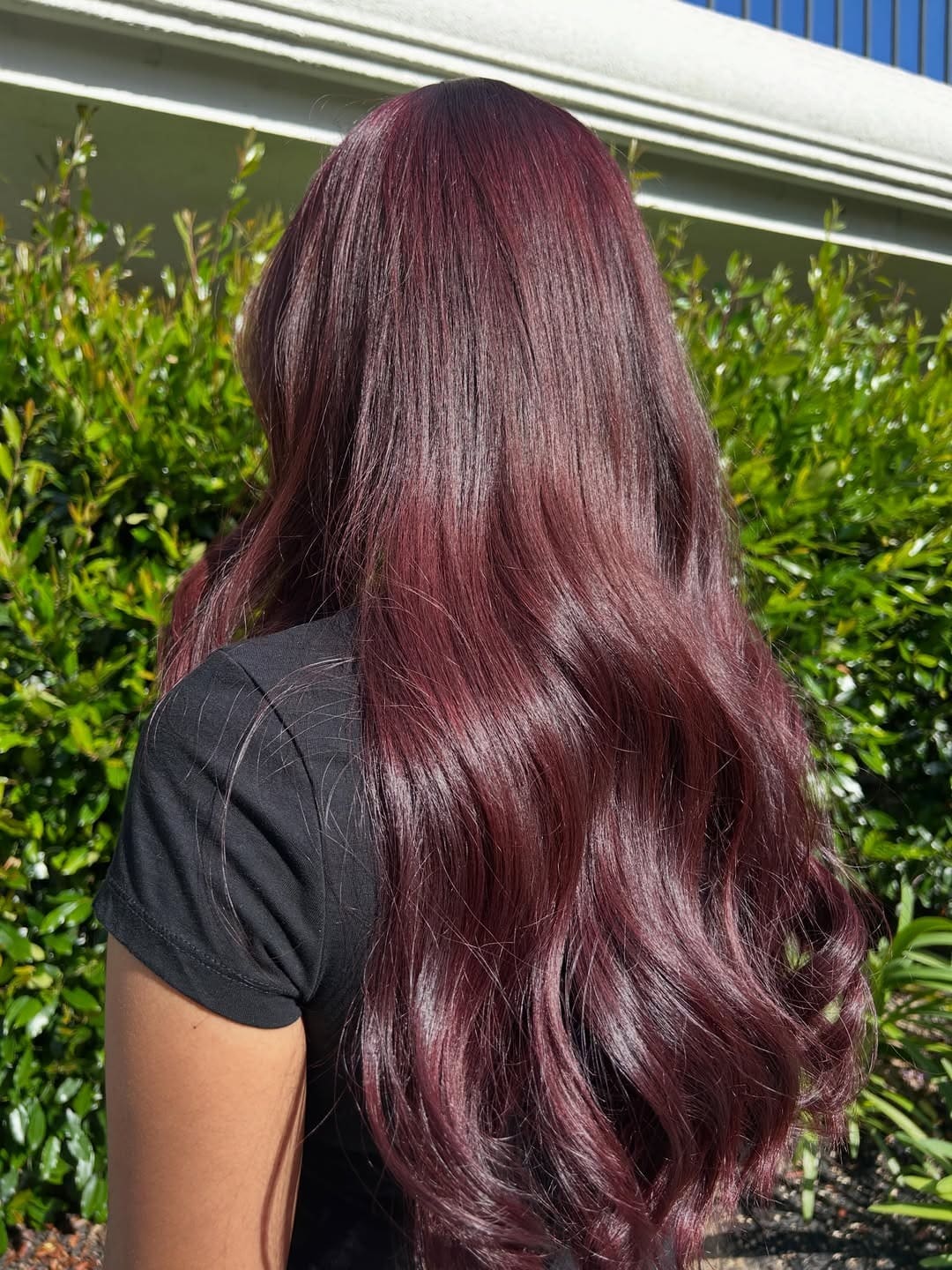 21. Glossy Cherry Cola Hair with Flowing Waves - Cherry Cola Hair Color
