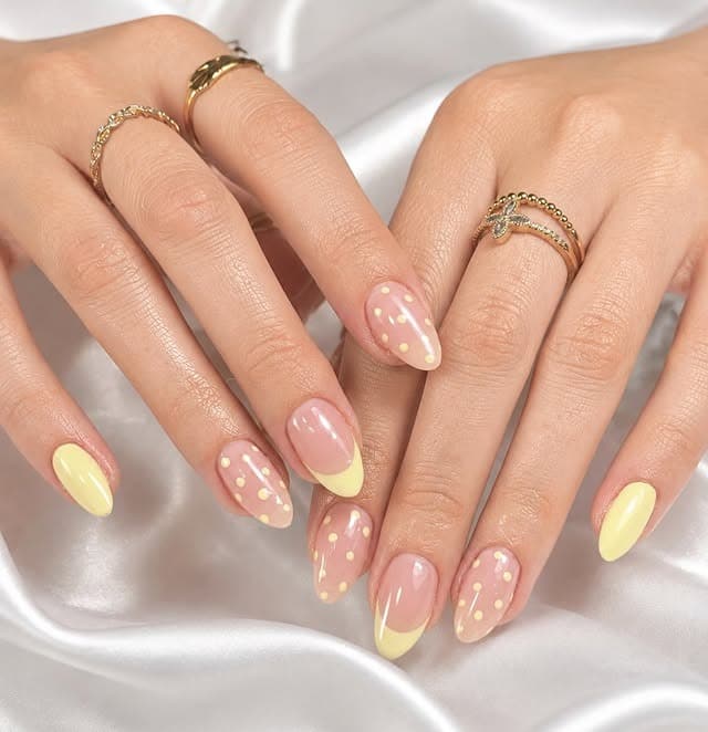 15. Pastel Yellow Polka Dot Almond Nails - simple summer nail ideas