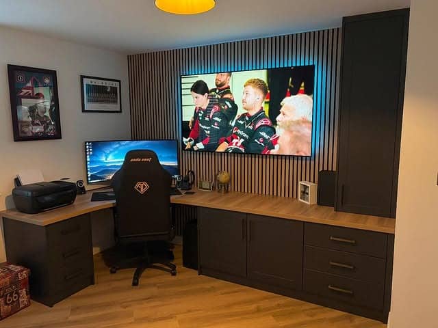 21. Black and Natural Wood Built-In Gaming Office Idea - gaming office ideas