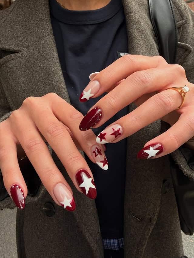 1. Burgundy and White Star Almond Nails - star nail ideas