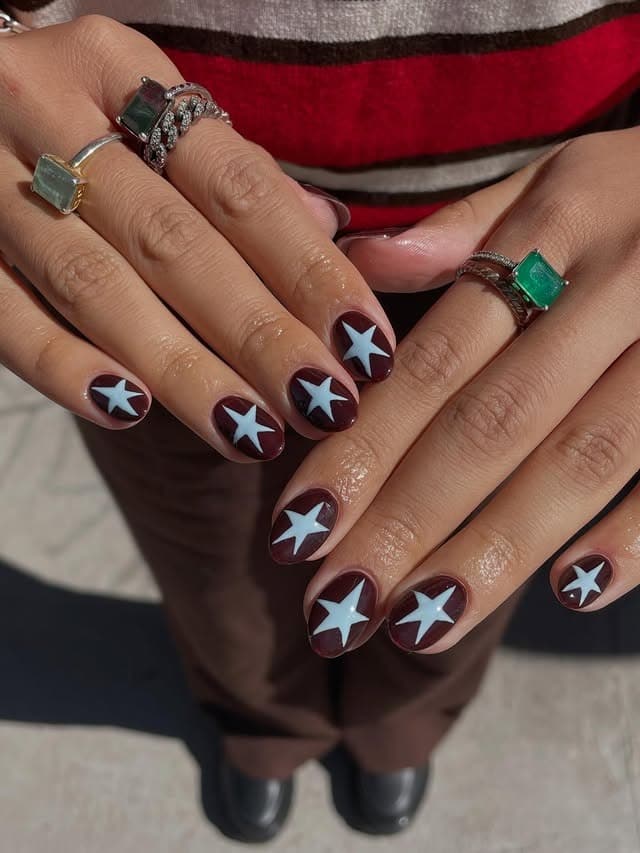 3. Burgundy and Pale Blue Star Round Nails - star nail ideas