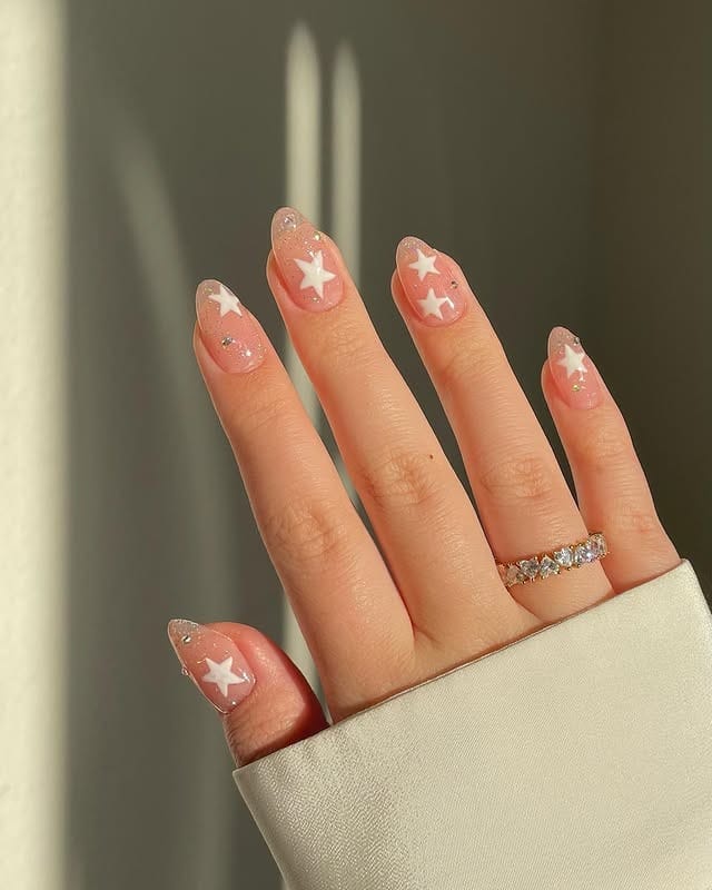 5. Sheer Pink and White Star Glitter Nails - star nail ideas