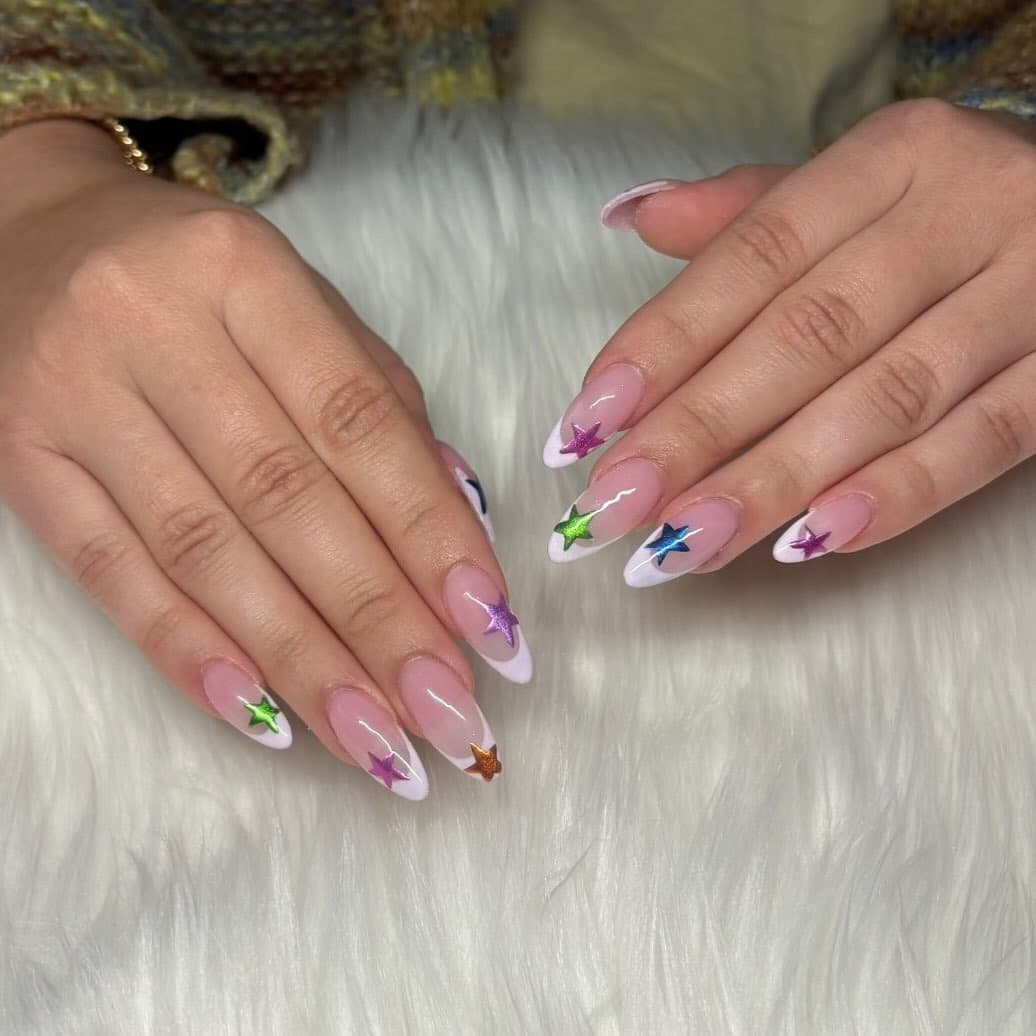 12. White French and Multicolor Star Almond Nails - star nail ideas
