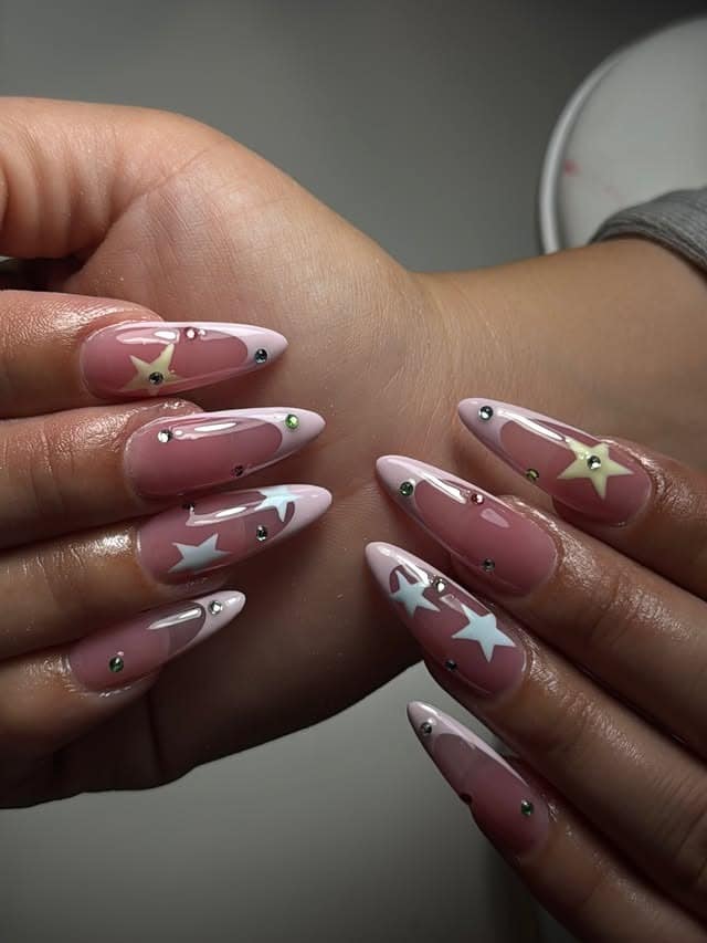 15. Blush Pink and White Star Rhinestone Nails - star nail ideas