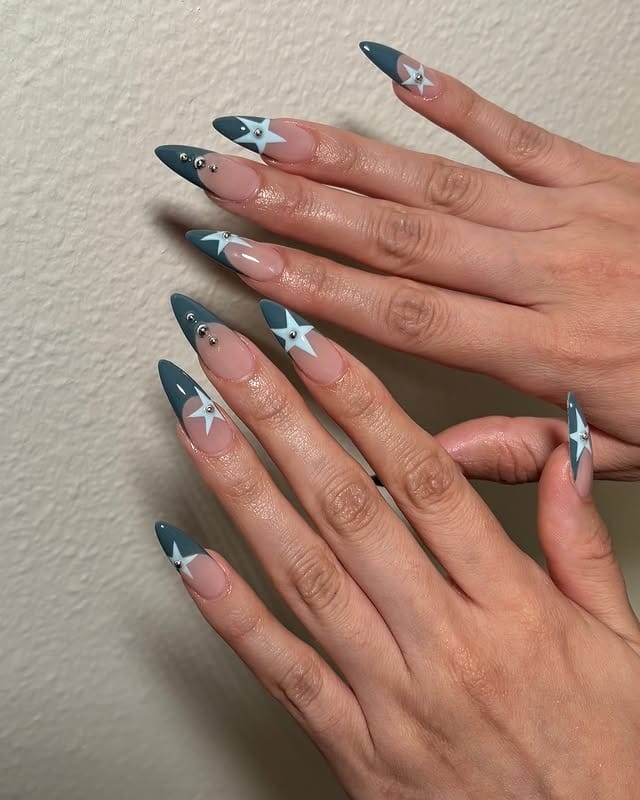 16. Dusty Blue and White Star Stiletto Nails - star nail ideas