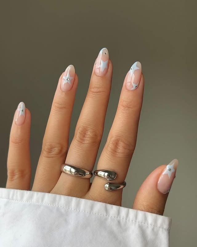 18. Sheer Nude and White Star Almond Nails - star nail ideas