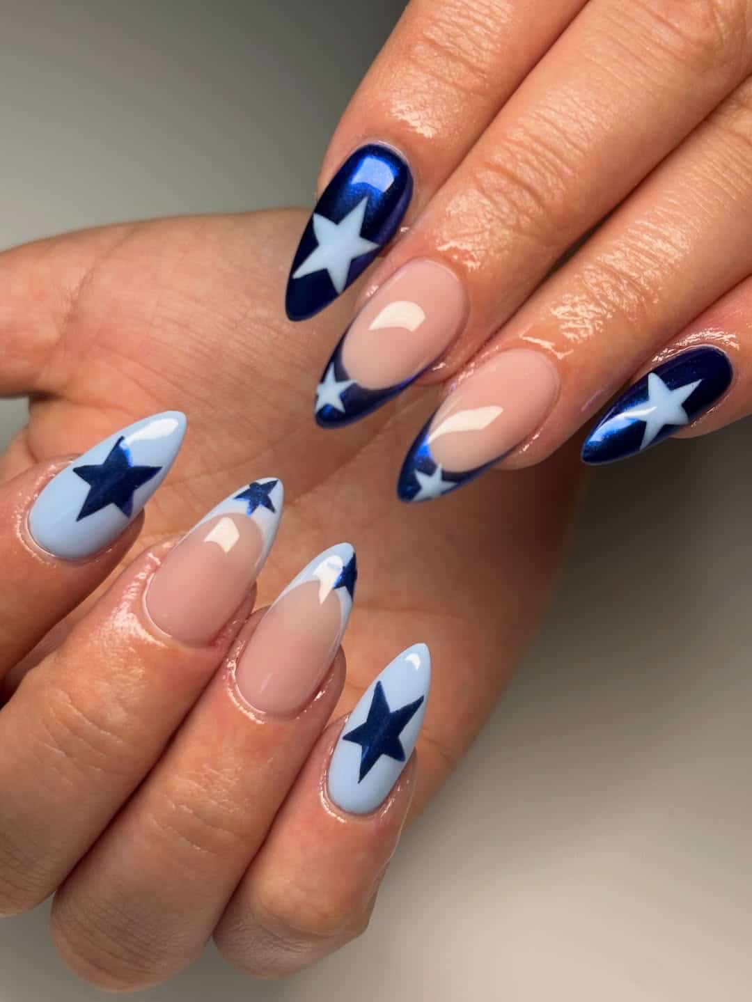 21. Navy Blue and Baby Blue Star Almond Nails - star nail ideas