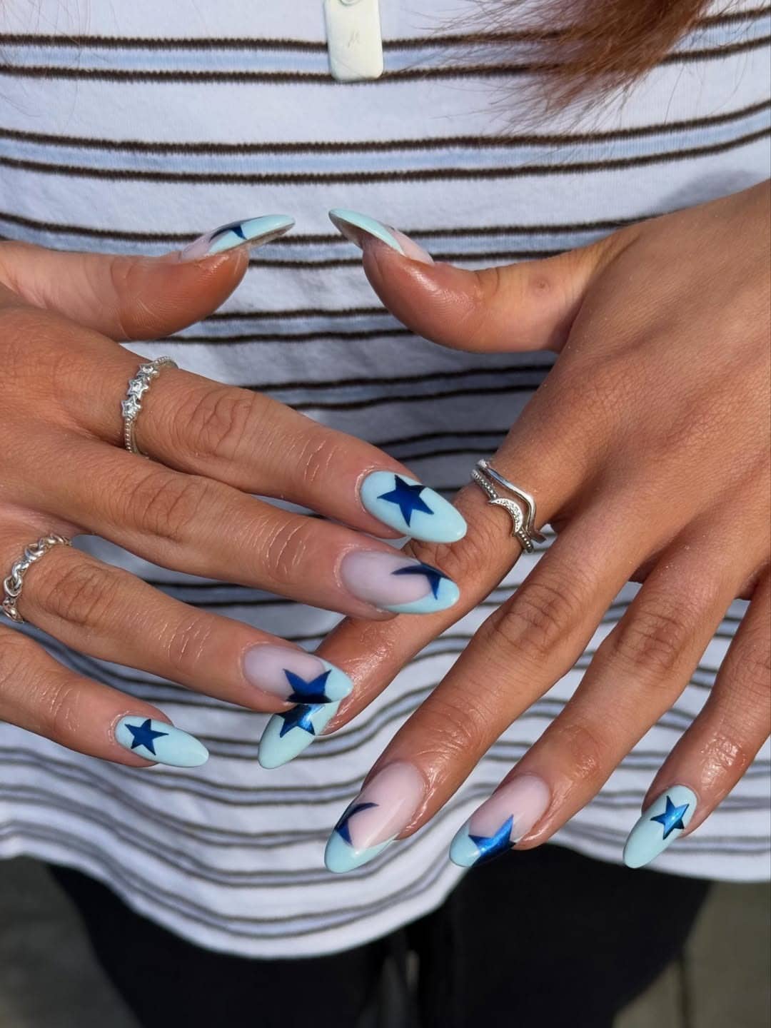 22. Mint Blue and Metallic Navy Star Almond Nails - star nail ideas