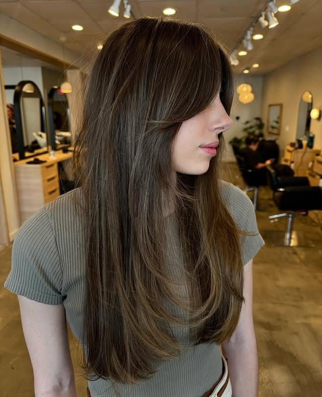 1. Long Ash Brown Butterfly Haircut with Curtain Bangs - Face-Framing Haircuts