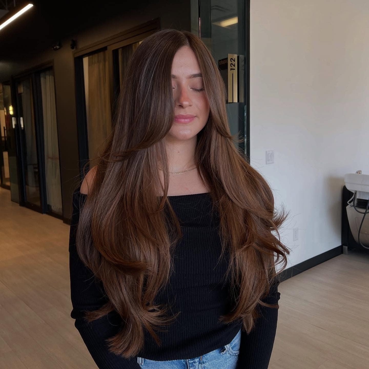 12. Warm Chestnut Brown Long Layers with Curtain Bangs - Face-Framing Haircuts