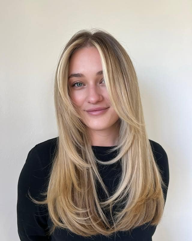 15. Golden Blonde Face-Framing Layers with Long Curtain Bangs - Face-Framing Haircuts