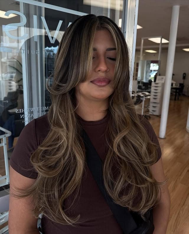 17. Caramel Bronde Butterfly Haircut with Face-Framing Highlights - Face-Framing Haircuts