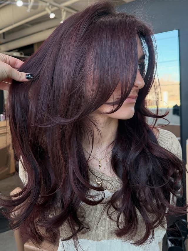 18. Deep Burgundy Brown Long Layers with Curtain Bangs - Face-Framing Haircuts