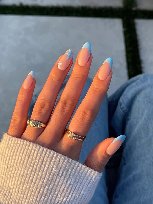 1. Baby Blue French Tip Almond Nails with Starfish Accent - aesthetic nail ideas