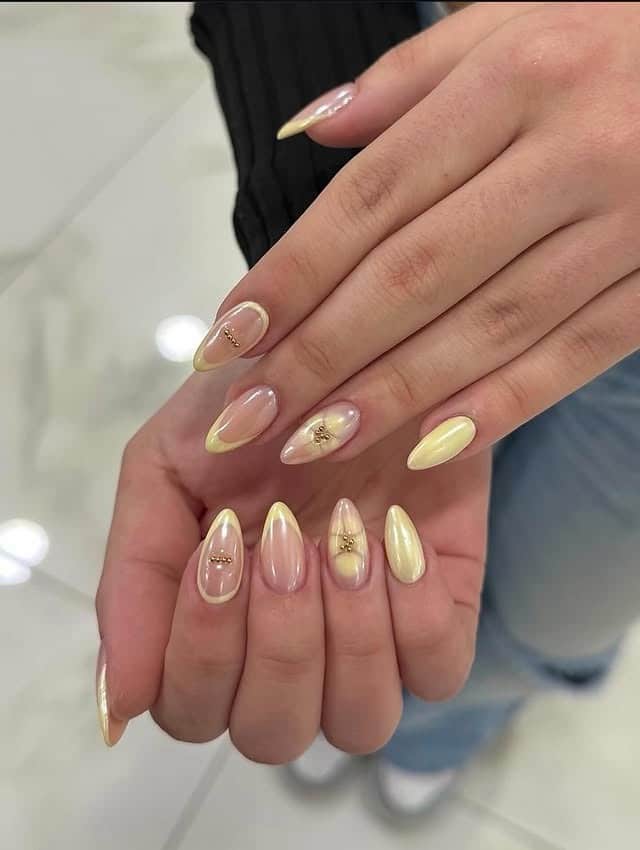 3. Pastel Yellow Chrome Almond Nails with Gold Accents - aesthetic nail ideas