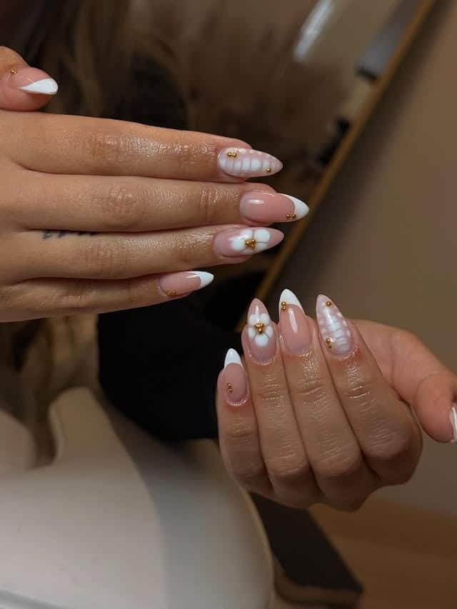 11. Milky White French Tip Almond Nails with 3D Floral Accents - aesthetic nail ideas