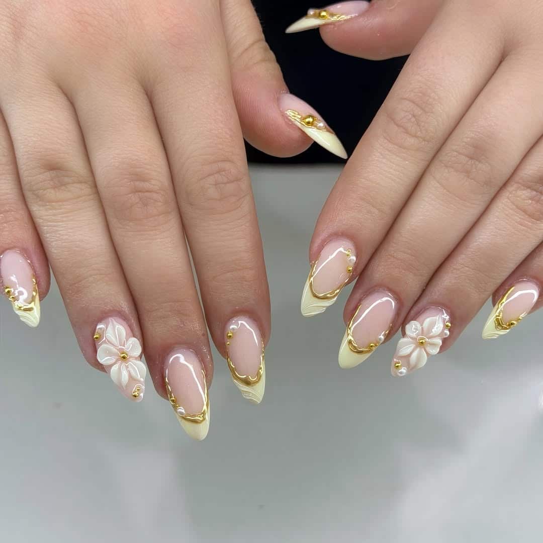 20. Butter Yellow French Tip Nails with Gold Chrome and 3D Flowers - aesthetic nail ideas