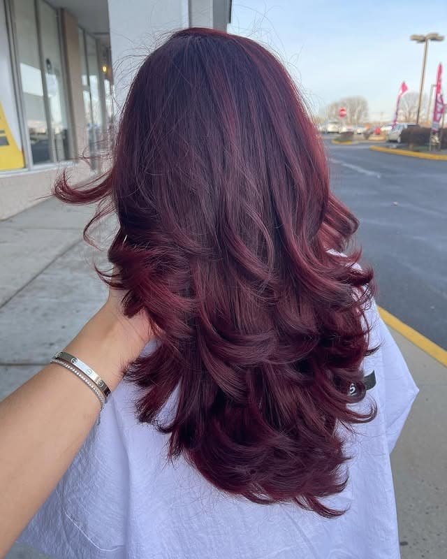 5. Dark Burgundy Balayage with Voluminous Layered Curls - Burgundy Balayage Hair Color
