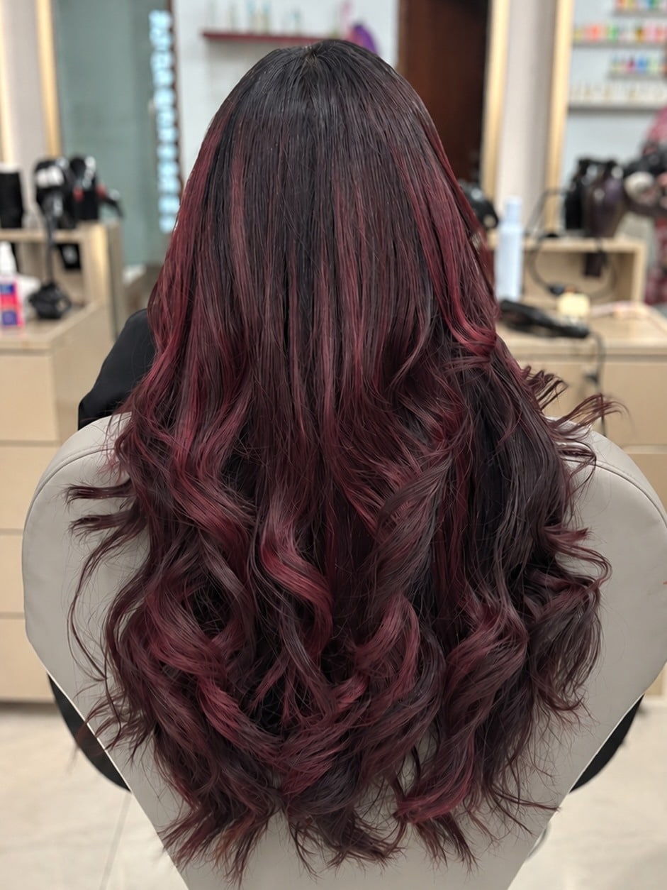 8. Dark Berry Burgundy Balayage with Cascading Curls - Burgundy Balayage Hair Color