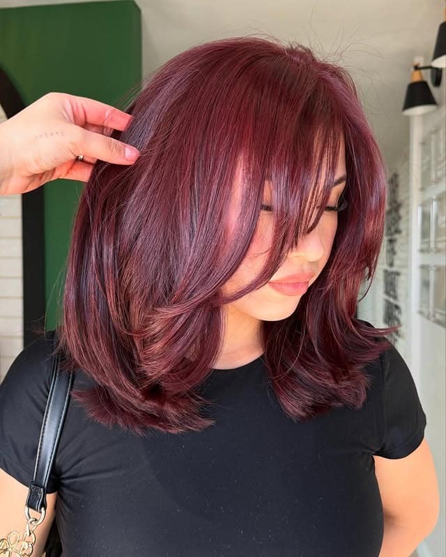 10. Raspberry Burgundy Balayage with Curtain Bangs - Burgundy Balayage Hair Color