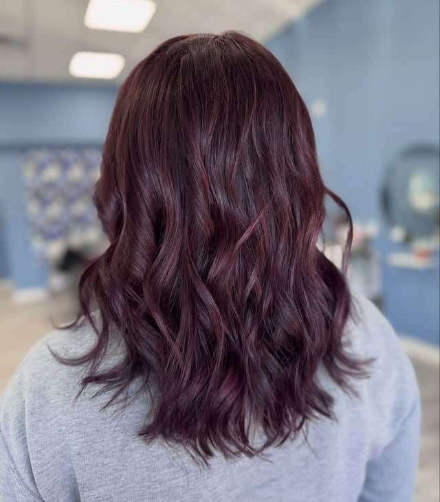 12. Dark Plum Burgundy Balayage with Tousled Waves - Burgundy Balayage Hair Color