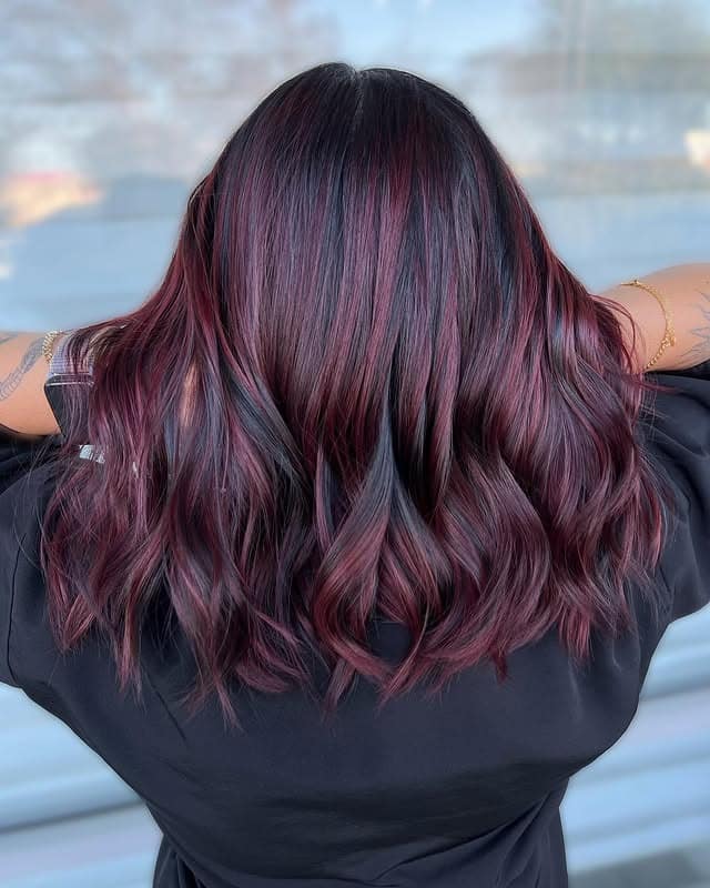 17. Smoky Plum Burgundy Balayage with Soft Curls - Burgundy Balayage Hair Color
