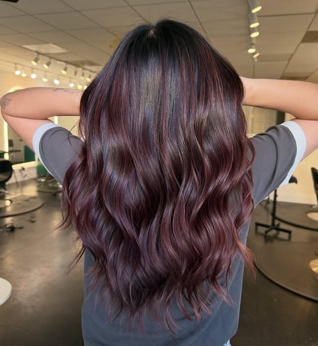 22. Plum Burgundy Balayage with Glossy Loose Waves - Burgundy Balayage Hair Color