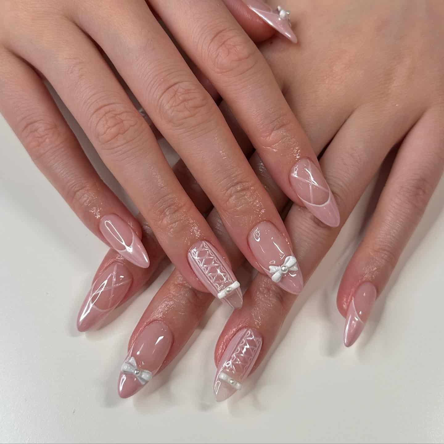 6. Sheer Pink Ballerina Nails with White Bows and Lace Details - ballerina nail ideas