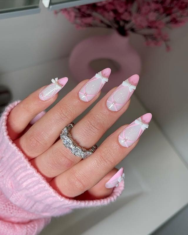 16. Baby Pink Glitter Ballerina Nails with 3D White Bows - ballerina nail ideas