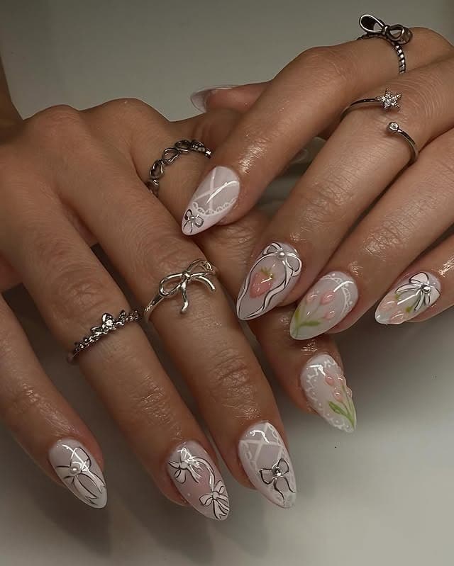 21. Milky White Floral Ballerina Nails with Silver Bow Accents - ballerina nail ideas