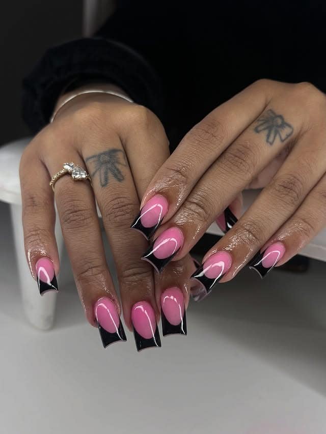 9. Pink and Black Deep V French Tip Nails - black and pink nail ideas