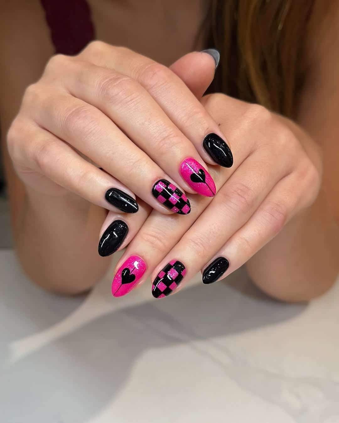 13. Glitter Pink and Black Checkered Almond Nails - black and pink nail ideas