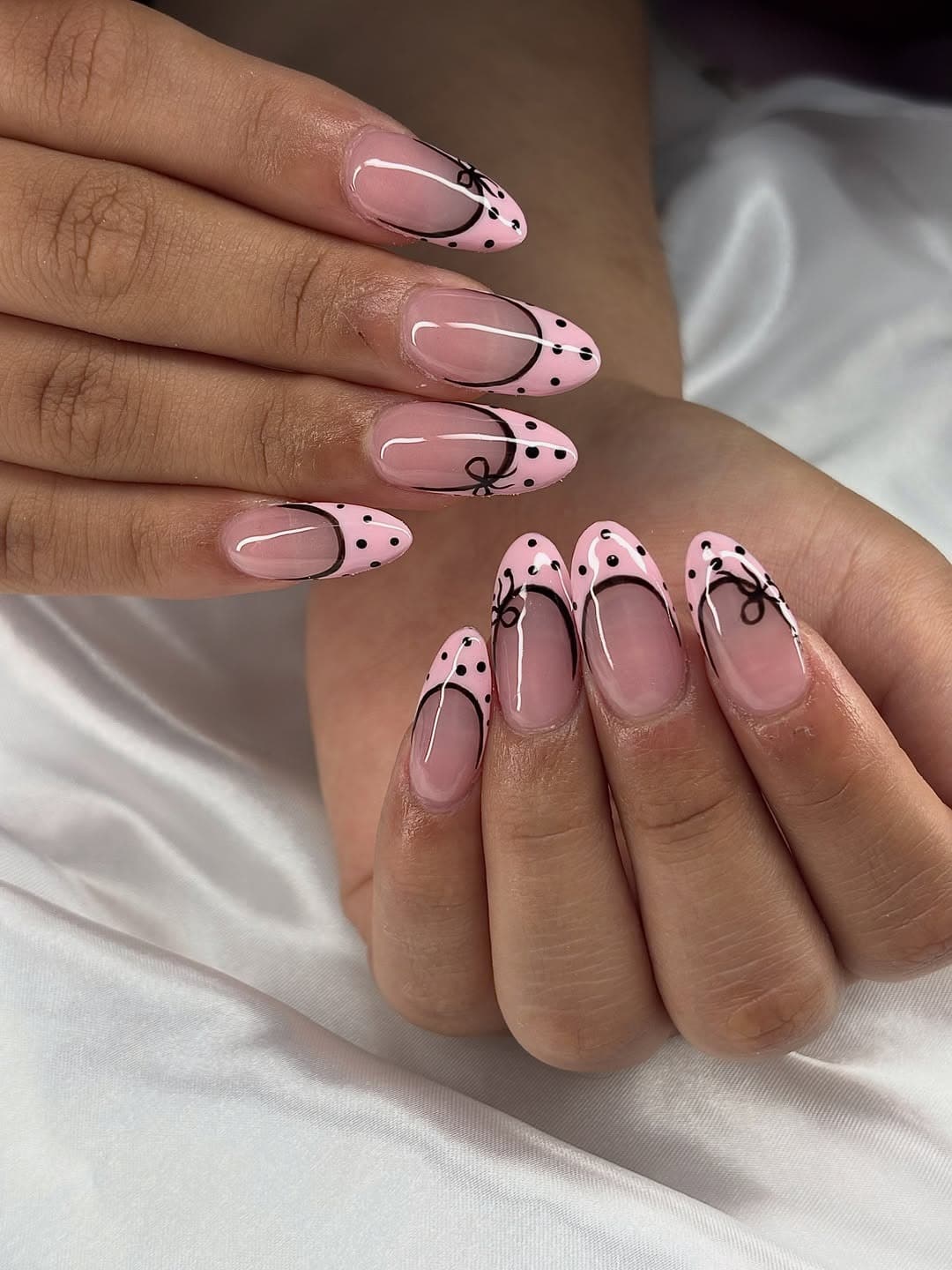 20. Light Pink and Black Bow French Tip Almond Nails - black and pink nail ideas