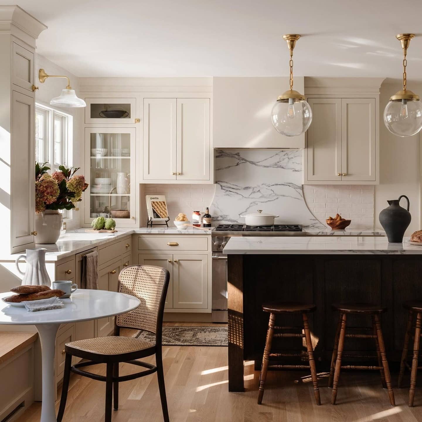 5. Cream Kitchen Cabinets with Espresso Brown Island - kitchen color ideas with white cabinets