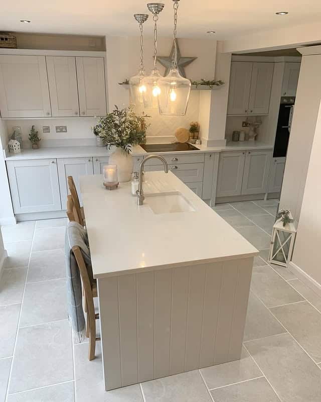 8. Soft Greige Kitchen Island with White Cabinets - kitchen color ideas with white cabinets