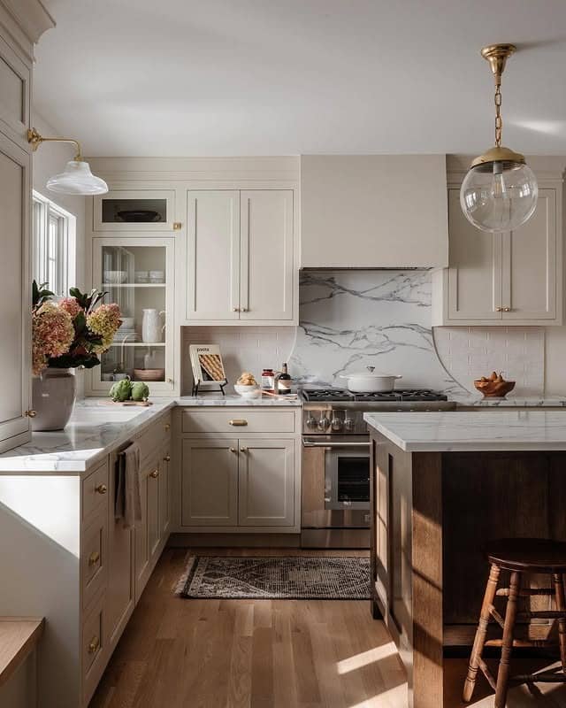 22. Creamy White Kitchen with Dark Walnut Island and Marble Accents - kitchen color ideas with white cabinets