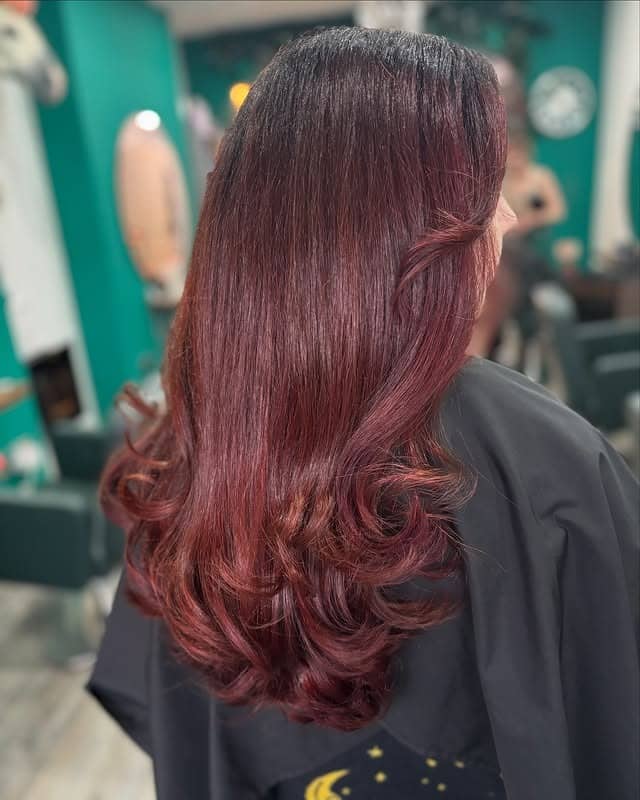2. Dark Mahogany Red Hair with Soft Feathered Layers - Mahogany Hair Color