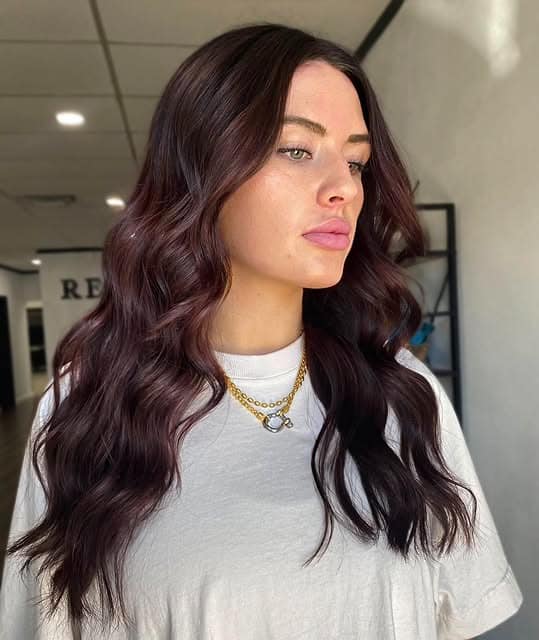 16. Dark Wine Mahogany Hair with Long Face-Framing Waves - Mahogany Hair Color